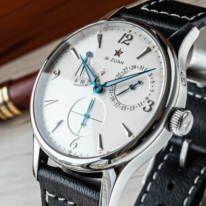 1963 Pilot mechanical wristwatch next to aviation gear and compass