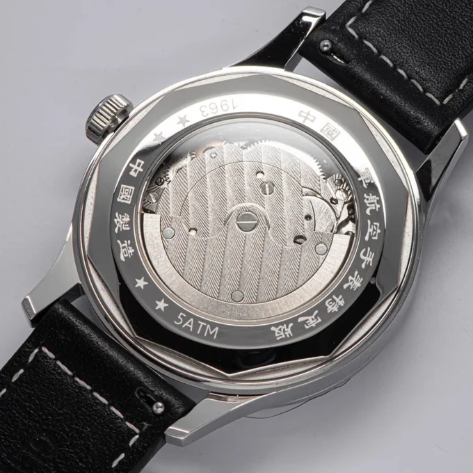 Side view of 1963 Pilot Watch showing stainless steel case and crown